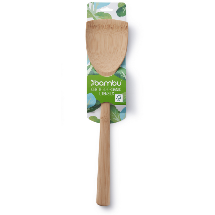 The Bambu Bamboo Wok Spatula features a broad, flat head ideal for Chinese stir-frying and comes in packaging with green leaf graphics.
