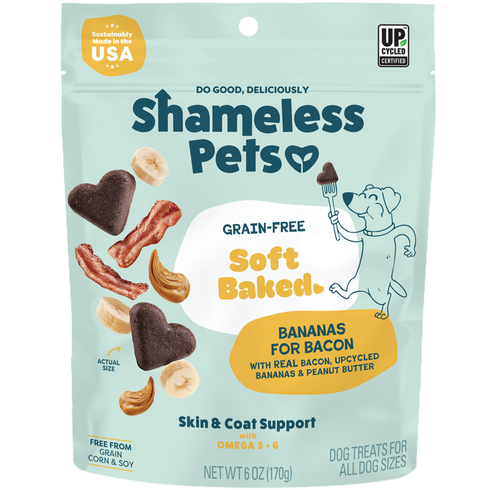 Shameless Pets Bananas for Bacon Soft-Baked Dog Treats are grain-free, heart-shaped snacks made in the USA with upcycled ingredients like bacon, cashews, and bananas to support skin and coat health—featuring a fun cartoon dog on the package!.