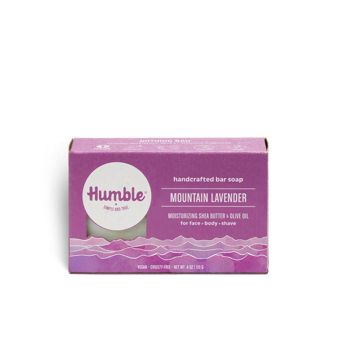 Humble Brands Mountain Lavender handcrafted bar soap features natural oils and eco-friendly packaging, with a purple design. It contains moisturizing shea butter and olive oil, ideal for face, body, and shaving. Vegan and cruelty-free, it weighs 4 oz (113 g).