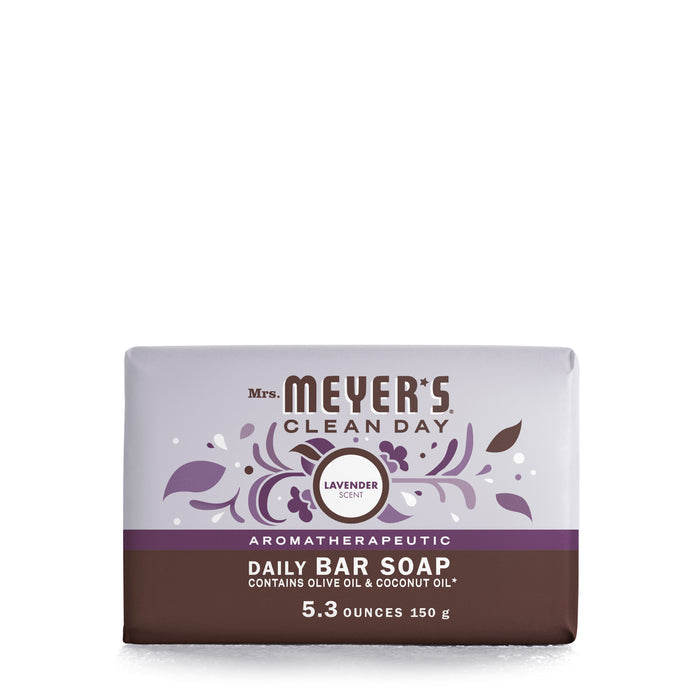 Mrs. Meyers Bar Soap boasts a calming lavender scent and comes in a rectangular shape with white and purple floral packaging. Highlighting natural ingredients like olive and coconut oil, this 5.3 oz (150g) Leaping Bunny certified soap offers delightful garden-inspired aromas.