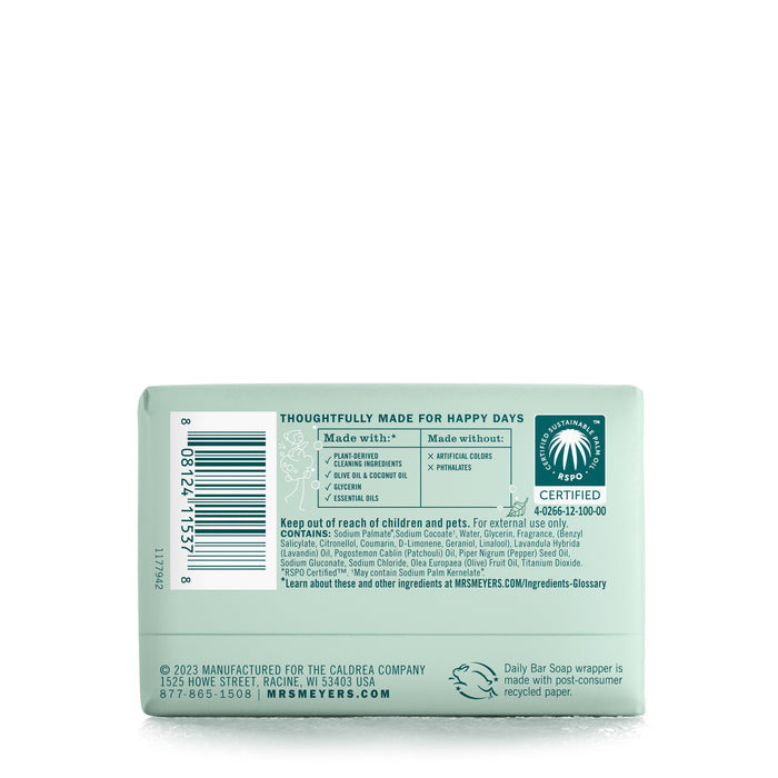 The image shows the back of a Mrs. Meyers Bar Soap package in light green, highlighting garden-inspired scents, Leaping Bunny certification, a barcode, ingredient lists, safety warnings, and manufacturer details.
