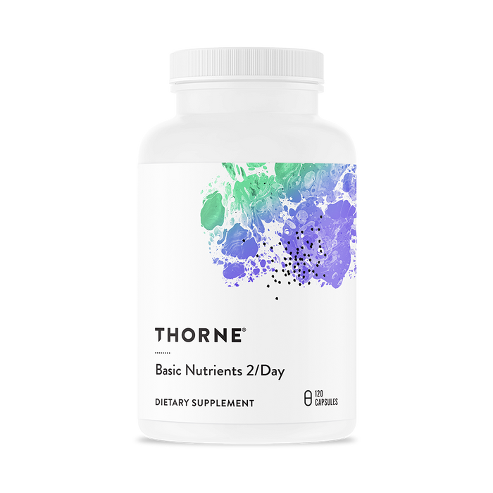 A white bottle of Thorne Basic Nutrients 2/Day daily multivitamin featuring abstract green and purple artwork on the label; contains 120 capsules.