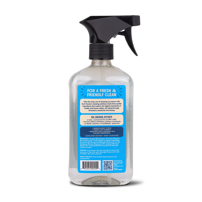 A clear spray bottle with a black trigger displays the label For a Fresh & Friendly Clean. It uses plant-based surfactants and vinegar. Ingredients, usage, barcode, and QR code are detailed at the bottom. Made by Aunt Fannies, its perfect for bathroom cleaning!.