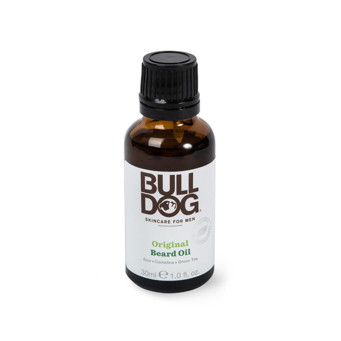Bulldog Beard Oil contains aloe vera, camelina, and green tea for nourishing facial hair. The brown 30 ml (1.0 fl oz) bottle with a black cap houses essential oils to maintain healthy beards.