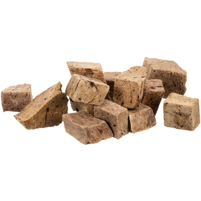 A random stack of West Paw Beef Liver Freeze Dried Raw Single Ingredient Dog Treats against a white background features textured surfaces and varied brown hues, highlighting the rich quality of grass-fed liver.