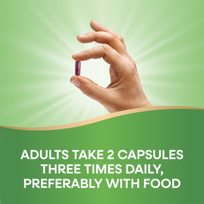 A hand holds a red Natures Way Beet Root capsule against a green background with rays, above text reading: Adults take 2 capsules three times daily, preferably with food for plant-based antioxidant support.