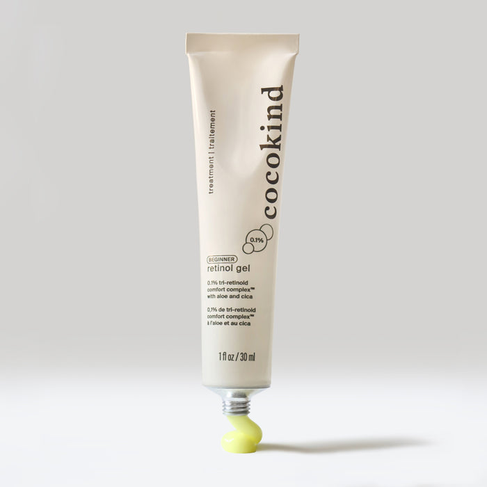 Cocokinds Beginner Retinol Gel, in 1 fl oz / 30 ml beige packaging, stands upright with the cap at the bottom. It features the Tri-Retinoid Comfort Complex™ and displays the National Eczema Association Seal of Acceptance™, allowing gentle dispensing of a small amount of gel.