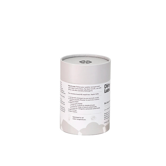 A cylindrical container of Dirty Labs Bio Enzyme Laundry Booster features a gray lid and a white label displaying product instructions and icons. Showcasing cutting-edge enzyme technology, this laundry booster is specially formulated to effectively remove biological stains. The container is centered against a white background.