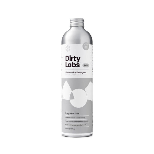 A silver bottle of Dirty Labs Bio Laundry Detergent with Phytolase® - Free & Clear, a fragrance-free formula designed for sensitive skin. The sleek container features abstract white shapes on the label, comes with a screw cap, and holds 640 mL (21.6 fl oz).