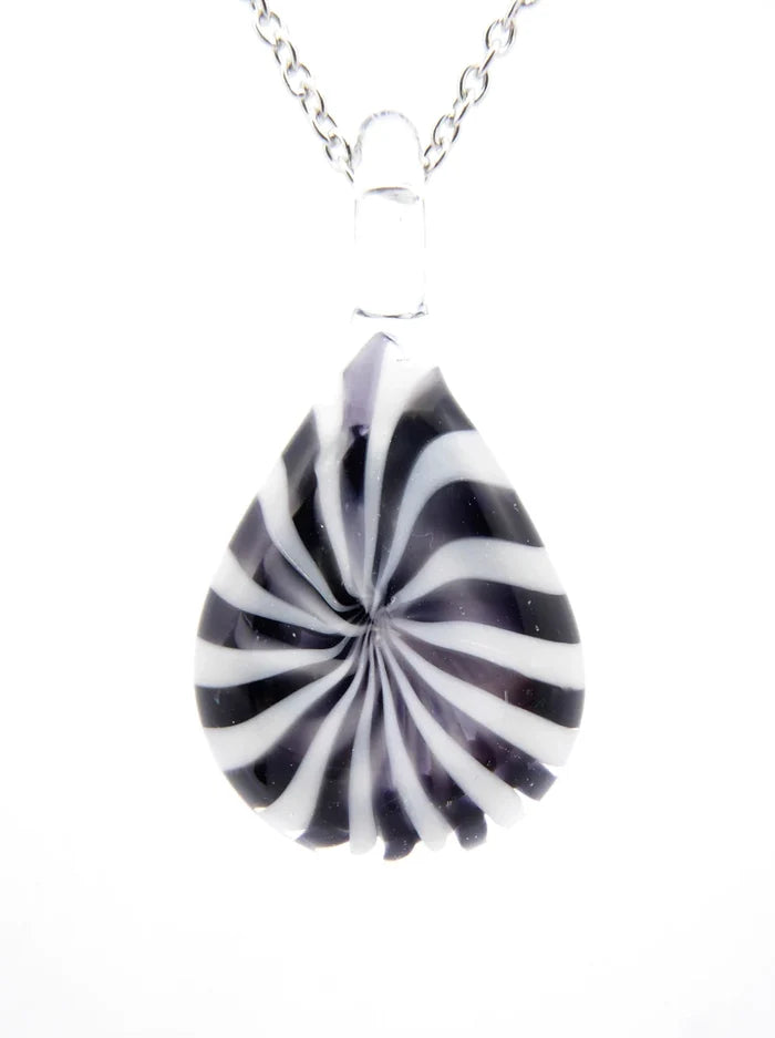 Teardrop shaped glass pendant with black and white swirl pattern on a white background.