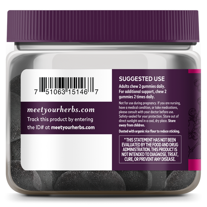 Gaia Herbs Black Elderberry Extra Strength Gummies with a purple lid and label provide immune support. The label includes usage instructions and a link to meetyourherbs.com for product tracking, while inside are organic, round dark gummies.