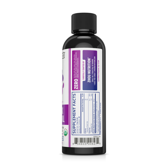A black bottle from Zhou Nutrition features a purple and white label, revealing nutritional supplement facts on one side. The label includes a barcode plus details about Black Seed Oil ingredients with omega 3-6-9 benefits.