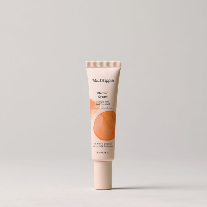 Mad Hippie Blemish Cream, designed for spot treatment and breakouts, contains apple, willow bark, niacinamide, and vitamin B5. The package features an abstract peach design against a plain background.