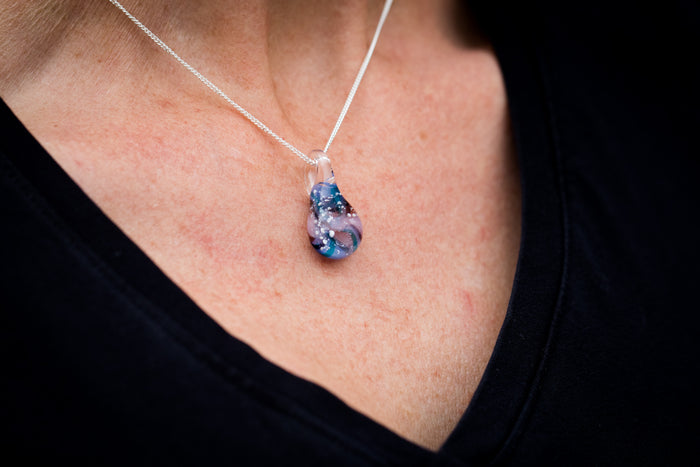 cremation jewelry pendant blue swirl with cremation ashcremation jewelry pendant blue swirl with cremation ash worn