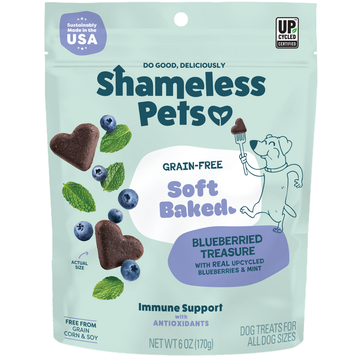 A package of Shameless Pets Blueberried Treasure Soft-Baked Dog Treats, featuring blueberries, heart-shaped treats, and a cartoon dog holding a fork.