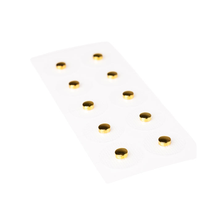 A white blister pack with 10 round, gold-colored tablets arranged in two columns, formulated to support a healthy sleep cycle and promote overall well-being from WTHNs Body Balance Magnets line.