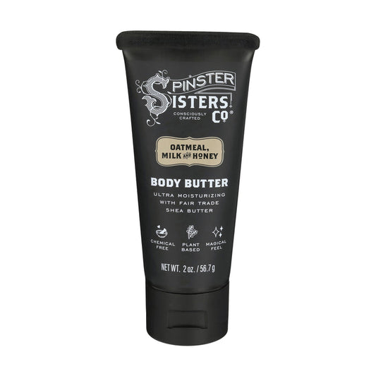 A 2 oz black tube of Spinster Sisters Co. Body Butter in Oatmeal, Milk, and Honey is lavender-infused and features descriptions such as Consciously Crafted, Ultra Moisturizing with Fair Trade Shea Butter, Chemical Free, and Plant Based.