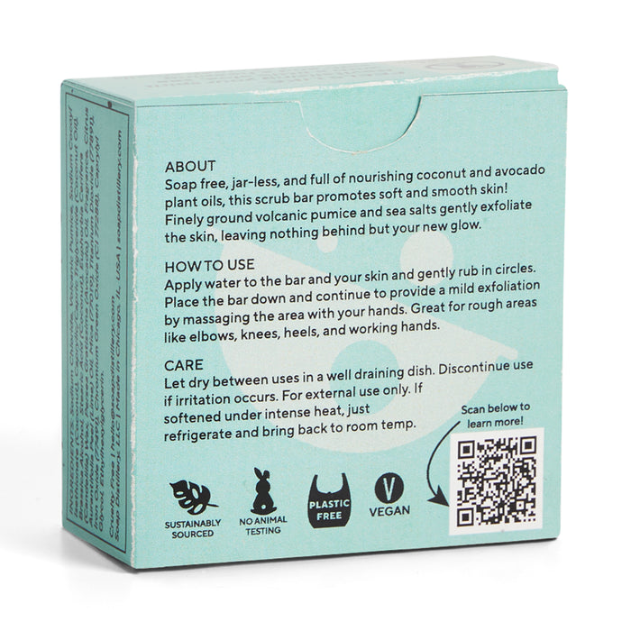 The image displays the back of Soap Distillerys Body Scrub Bar packaging, highlighting its moisturizing qualities, sustainable sourcing, plastic-free and vegan attributes. A QR code is visible next to instructions for use and care, all on a green background.