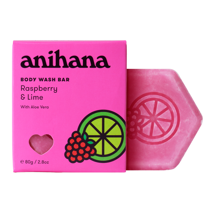 A vibrant pink Body Wash Bar box from Anihana, labeled Raspberry & Lime with Aloe Vera, sits beside a pink hexagonal bar adorned with raspberry and lime slices—ideal for an invigorating cleanse.