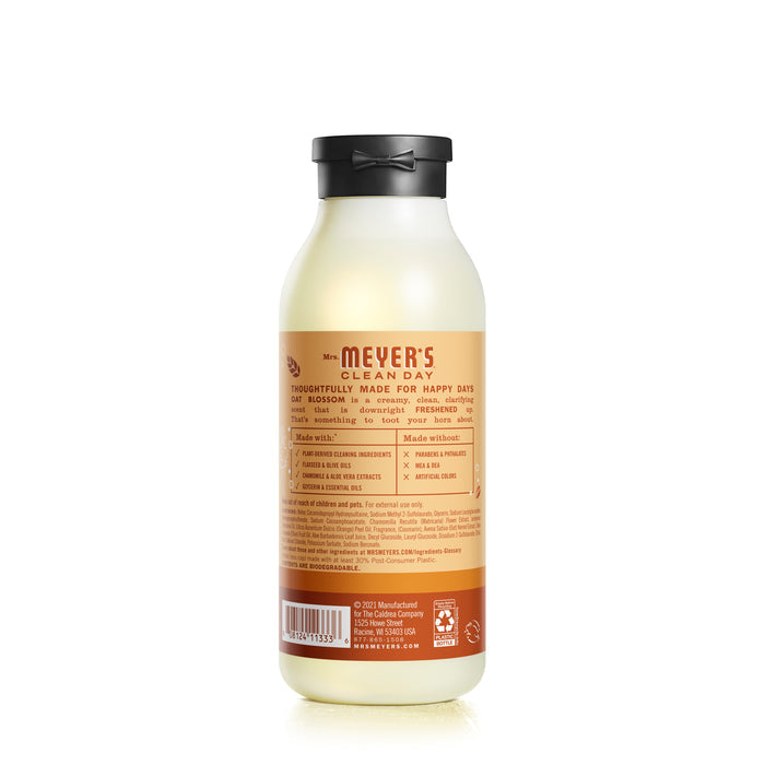 A bottle of Mrs. Meyers Body Wash features environmentally friendly ingredients and garden-inspired fragrances. The frosted bottle with an orange label and black cap offers clear usage instructions for eco-conscious users.