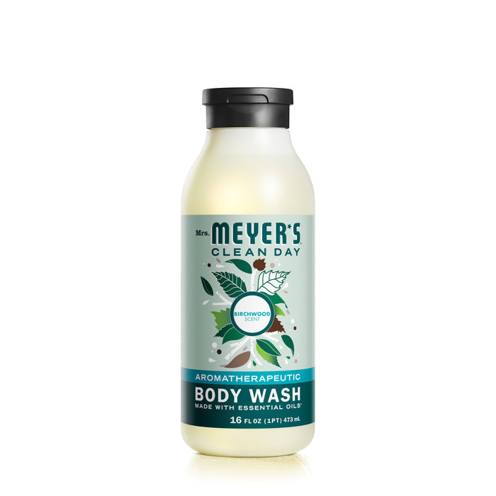 A 16 fl oz (473 mL) bottle of Mrs. Meyers Body Wash offers a refreshing Birchwood scent and essential oils, highlighted with green leaves and yellow flowers on an eco-friendly label.
