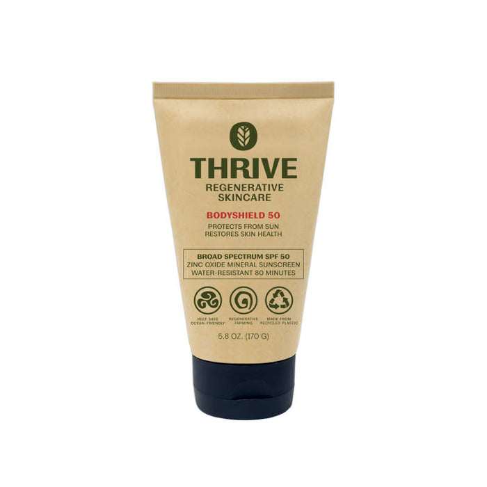 A tan tube of Thrive Natural Cares BodyShield 50, a broad-spectrum SPF 50 mineral sunscreen with non-nano zinc oxide. The reef-safe formula offers sun protection, skin restoration, and 80-minute water resistance in a 5.8 oz (170 g) capacity.