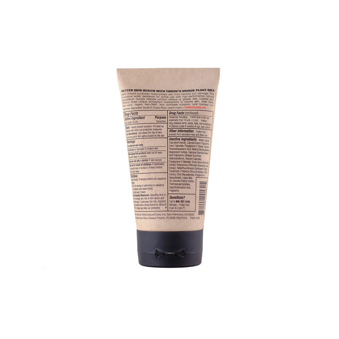 The beige BodyShield 50 tube from Thrive Natural Care, with a black cap, is shown from the back. The label in English details reef-safe, non-nano zinc oxide ingredients and usage instructions on its compact design, offering broad spectrum SPF 50 protection.