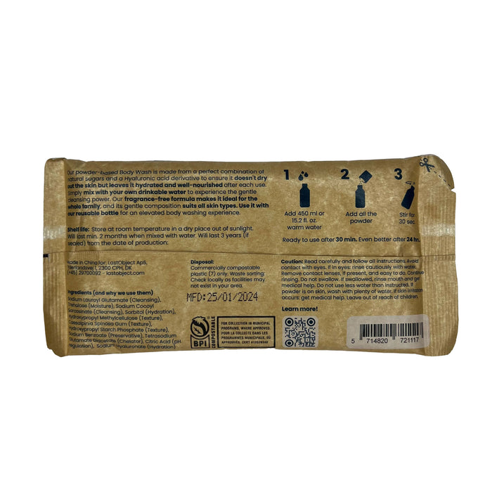Back view of a scrunched Bodywash Refill packet by LastObject, ideal for sensitive skin. Includes preparation steps with warm water, application guidance, manufacture date (25/01/2024), barcodes, certification logos and tips for reducing plastic waste at the bottom.