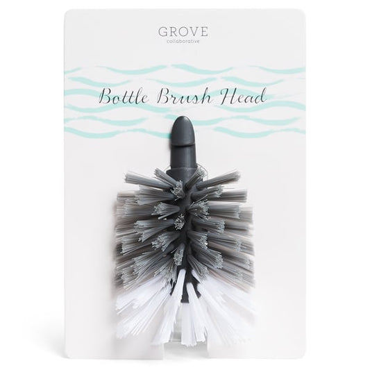 The Grove Co. Bottle Brush Replacement Head, ideal for cleaning water and baby bottles, is gray and white, attached to a white card labeled Grove Co. Bottle Brush Replacement Head with a stylish blue wave design at the top.