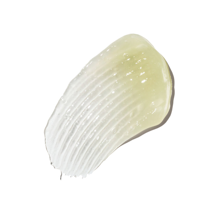 Ursa Major’s Bright and Easy Flash Mask, a translucent gel-like enzyme facial mask, is spread in an oval shape on a white background, showing textured ridges that highlight its natural skincare appeal.