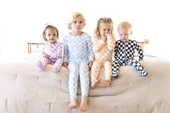 BRIGHT ORANGE + WHITE CHECKER | FOOTIE ONE PIECE