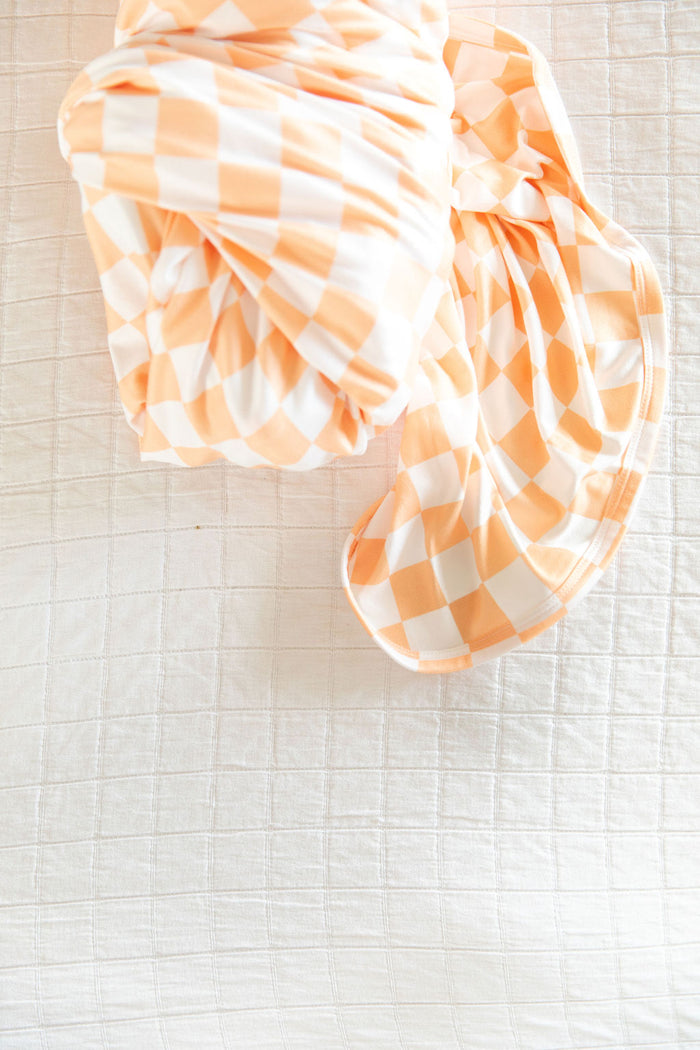 BRIGHT ORANGE + WHITE CHECKER | SWADDLE