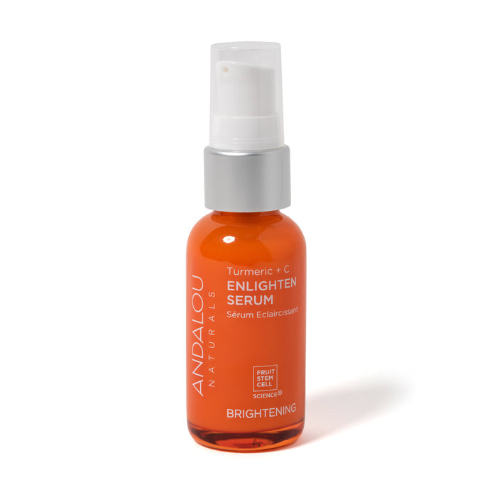 The Brightening Turmeric + C Enlighten Serum by Andalou Naturals comes in an orange bottle with a clear cap and spray nozzle. The label emphasizes its vitamin C benefits and fruit stem cell complex for radiant skin.