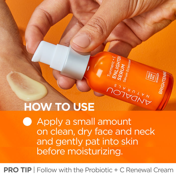 A hand holds a bottle of Andalou Naturals Turmeric + C Enlighten Serum, dispensing a small amount onto a person's hand. Text instructions: "Apply a small amount on clean, dry face and neck. Follow with Probiotic + C Renewal Cream.
