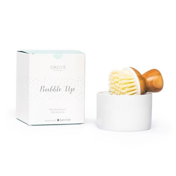 The Bubble Up Dish Soap Dispenser & Brush Set by Grove Co. is eco-friendly and comes with a ceramic dish, wooden-handled brush with white bristles. An elegant addition by Grove and Full Circle for any kitchen countertop.