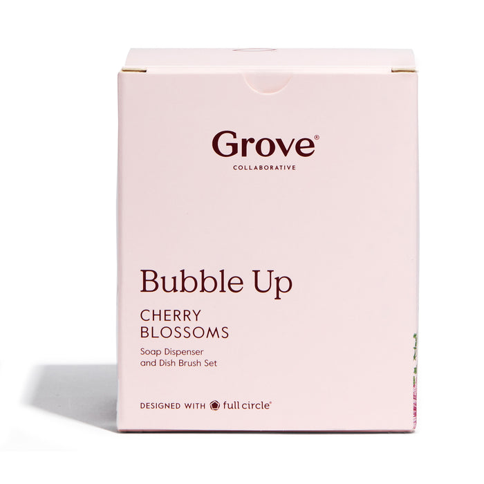 A beige box reads Grove Co. at the top with Bubble Up Cherry Blossoms below. It highlights the Bubble Up Dish Soap Dispenser & Brush Set, and notes Designed with Full Circle in smaller text at the bottom.