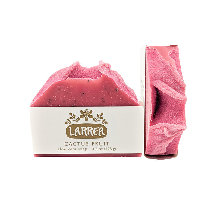 This bright soap is made with luxurious oils, butters, skin-loving aloe vera, and gently exfoliating poppy seeds leaving your skin soft, smooth, and refreshed.

The brilliant pink color comes from Himalayan Rhubarb powder.
The scent is fruity and floral with grapefruit, lavender, and ylang ylang.
Larrea soaps are handmade in Tucson, Arizona in small batches using only high quality oils, butters, essential oils, natural clays, and botanical colorants.
Formulated without palm oil in support of sustainability