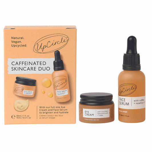 Discover UpCircles Caffeinated Skincare Duo: a beige box housing a jar of revitalizing eye cream and an organic face serum dropper, both enriched with upcycled coffee oil—ideal for rejuvenated skin.