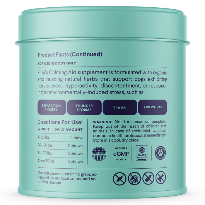 The image displays the back of a teal container of Finns Calming Aid Supplement for Dogs, highlighting its benefits for separation anxiety, thunder, travel, and fireworks. It includes weight-based dosage instructions and is made with natural ingredients that are organic, non-GMO, and plastic neutral.