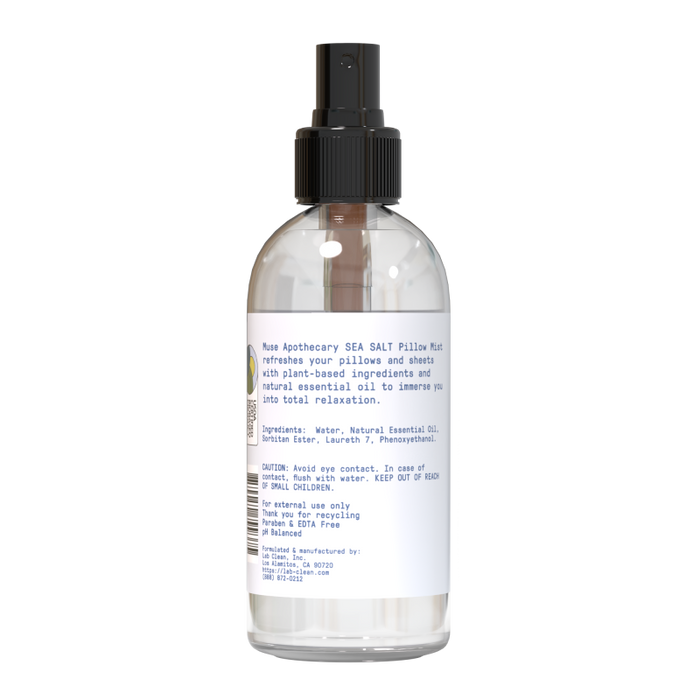 The Muse Apothecary Calming Pillow Mist comes in a clear spray bottle with a black nozzle and includes water and plant-based ingredients like natural essential oil. The label features warnings and recycling instructions.