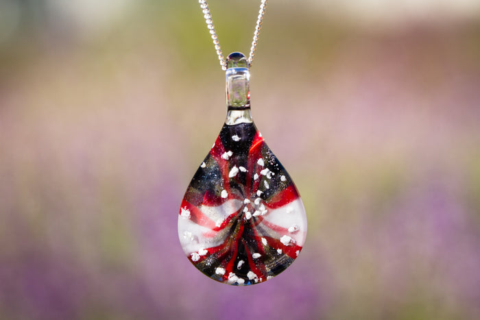 Candy stripe glass pendant infused with cremation ashes, teardrop shape on a silver chain