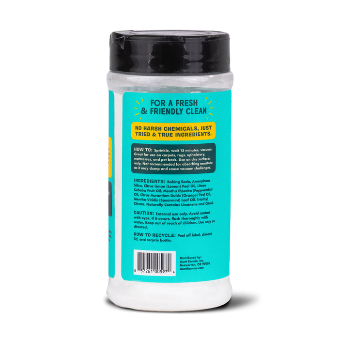 Aunt Fannies Carpet Refresher comes in a cylindrical container with a bright label featuring usage instructions and ingredients. It highlights eco-friendly aspects, guides on use and recycling, has a black cap, and a predominantly white body.