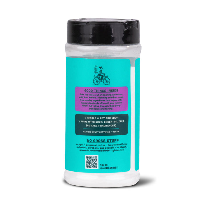 Aunt Fannies Carpet Refresher comes in a cylindrical container with a turquoise label and black lid. Pet and people-friendly, its made with essential oils, vegan, and free of harmful chemicals—ideal for natural carpet odor and stain removal.