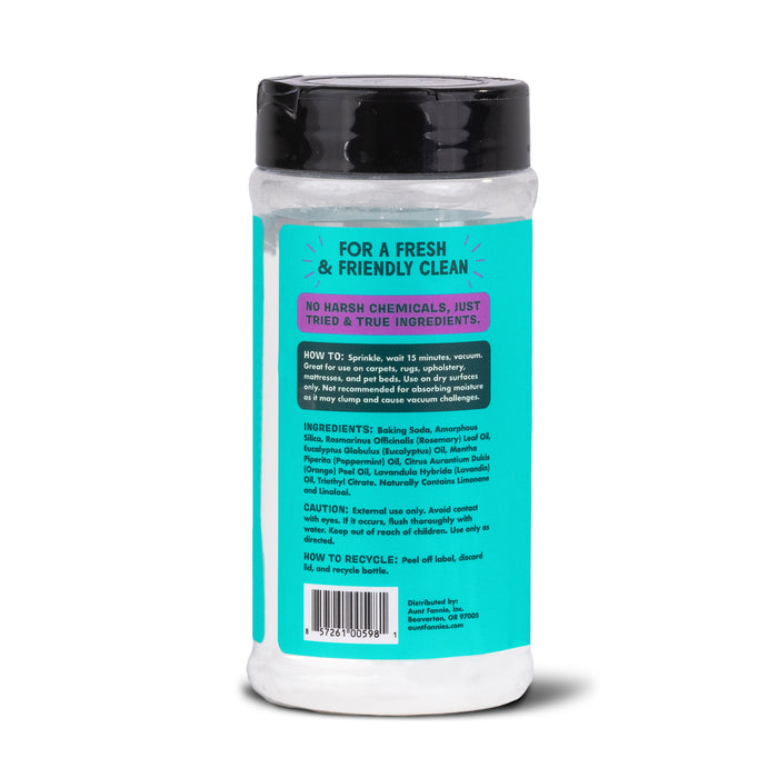 The image displays a cylindrical container of Aunt Fannies Carpet Refresher cleaning powder, featuring a turquoise label with use instructions, ingredients, caution, and recycling info. Its promoted as chemical-free and eco-friendly, effectively removing odors and stains for clean carpets.