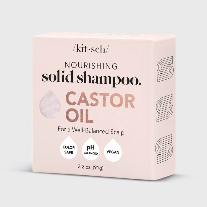 A beige box labeled Kitsch Castor Oil Nourishing Shampoo Bar features a glossy Nourish & Moisturize sticker. This 3.2 oz (91g) shampoo bar is perfect for color-treated hair, being color-safe, pH balanced, and vegan.