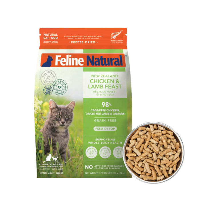 A bag of Feline Natural Grain-Free, Freeze-Dried Cat Food sits beside a bowl of its freeze-dried pellets. The Feline Natural packaging displays a cat and key product details.