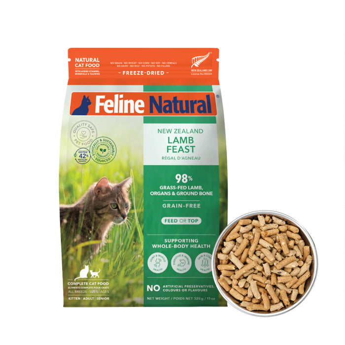 A bag of Feline Natural Grain-Free, Freeze-Dried Cat Food shows a cat in grass on the packaging, with a bowl of small pellet-shaped freeze-dried cat food beside it.