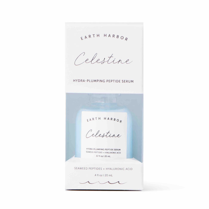 A white box labeled Earth Harbor CELESTINE Hydra-Peptide Replenishing Serum contains a small blue bottle featuring seaweed peptides and hyaluronic acid. Experience celestial radiance with this vegan, cruelty-free serum through its front cutout.