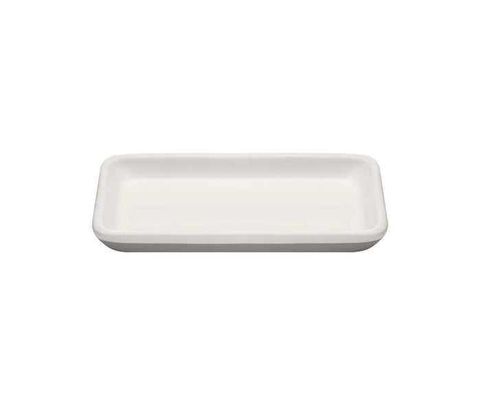 The Ceramic Keep Tray by Full Circle is a rectangular white ceramic tray with rounded edges, a flat surface, and a no-slip base for stability.