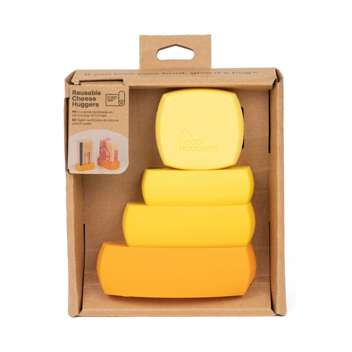 The space-saving Cheese Huggers set by Food Huggers includes four rectangular huggers in yellow shades, neatly packaged in cardboard with text and a charming illustration, designed to keep hard cheese fresh.